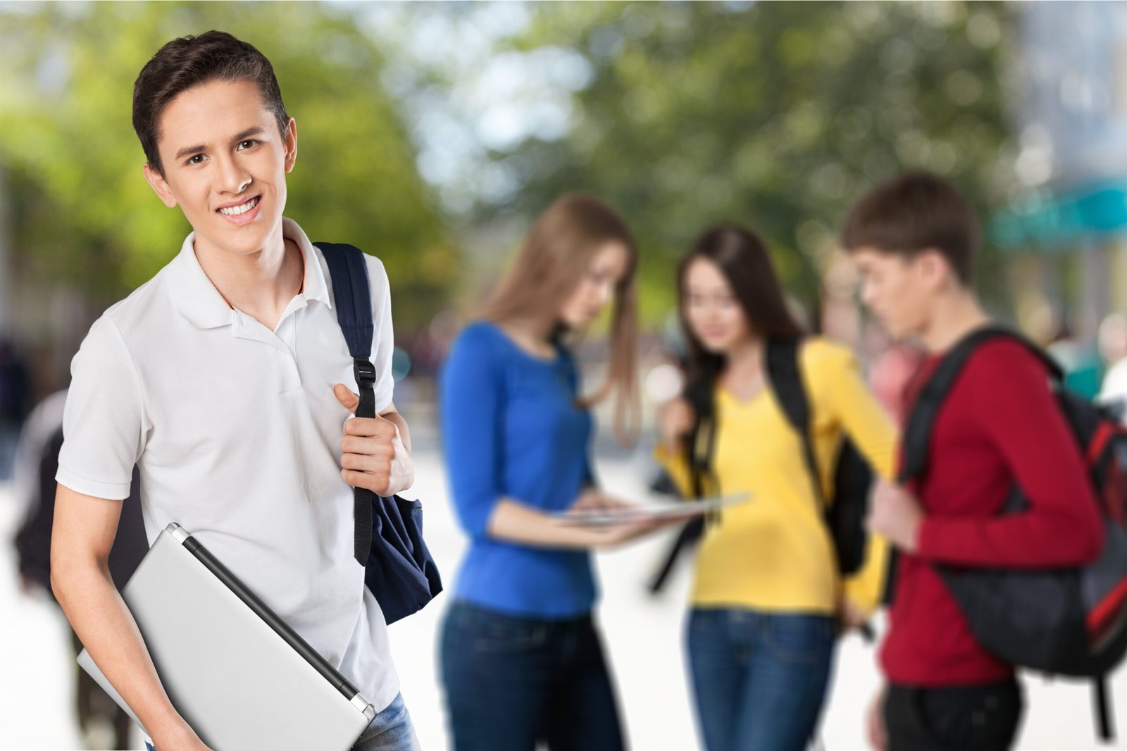 happy young student with laptop 1 scaled